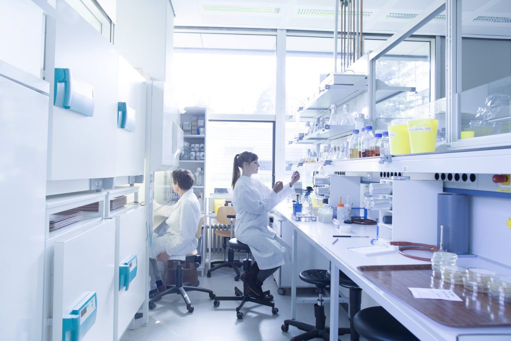 Microbiology lab young scientist woman working in a lab