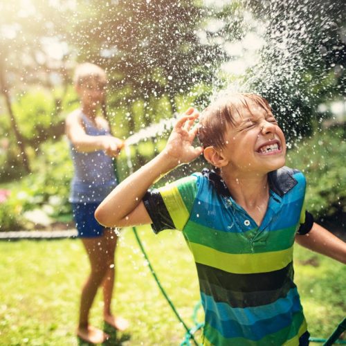 Kids playing water in the garden