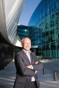 image of facilities director in front of new building