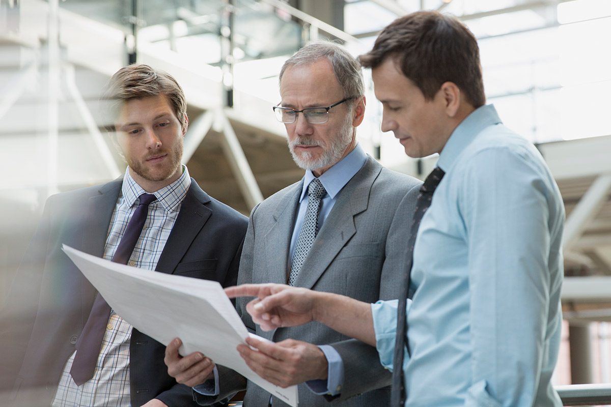 two men discussion data center consolidation with their boss