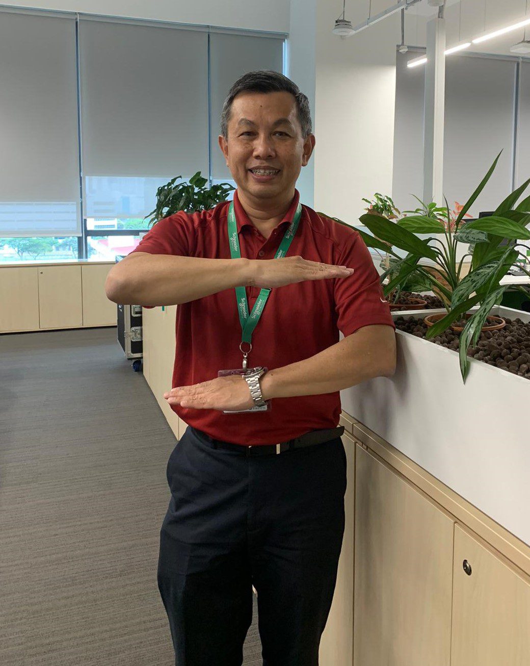 Leong showing the gender equality hand sign