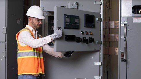 an engineer working on a control panel