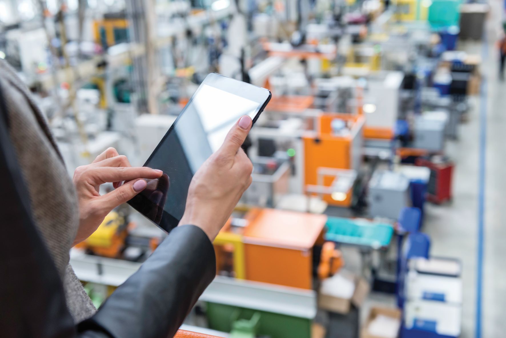 Operating factory controls after through a tablet after electrification and digitalization.