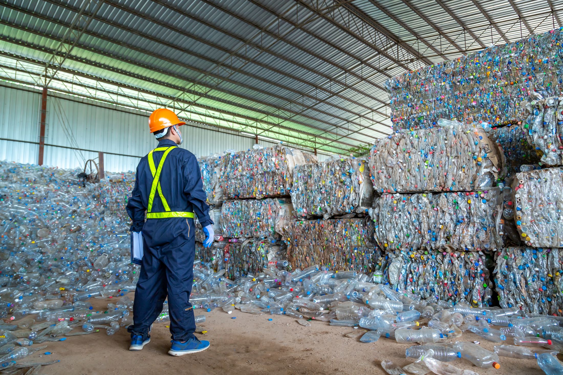 Plastics recycling facility with worker