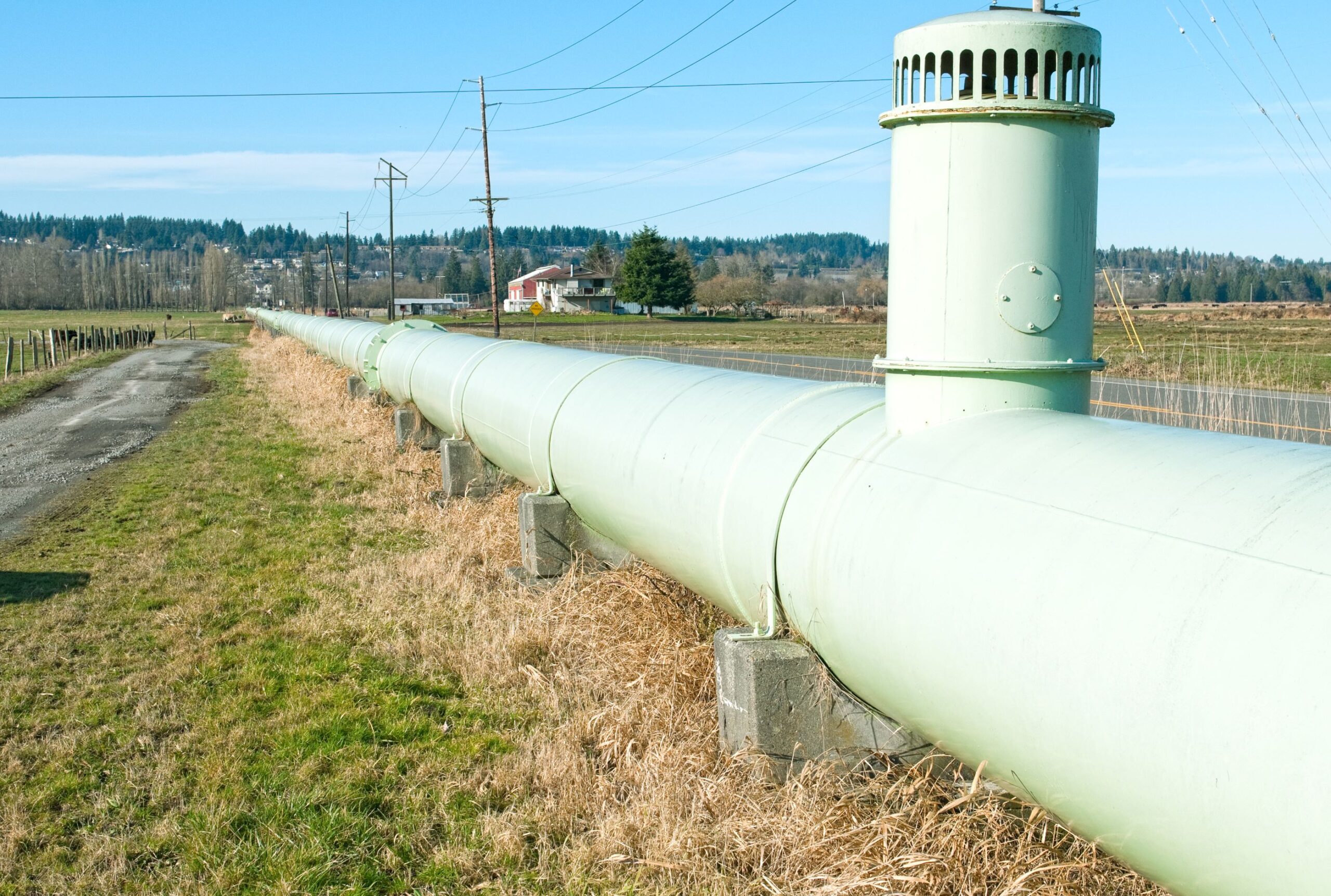 Pipeline running through an open field