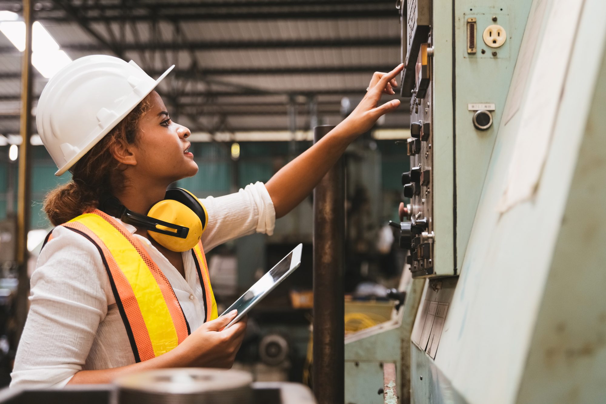 Worker at factory operating after digital transformation