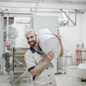 worker in modern grain mill