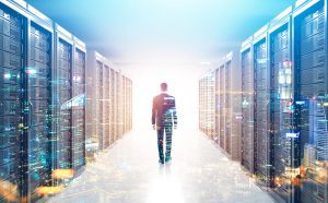 Man walking in a futuristic data center representing the evolution of Modern DCIM as Force for More Resilient, Secure, and Sustainable IT