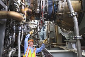 Employee working at industrial plant with improved functional safety