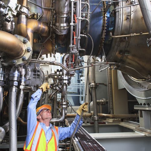 Employee working at industrial plant with improved functional safety