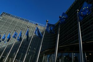 European Union flags waving at Berlaymont building of the European Commission representing a more resilient Europe.