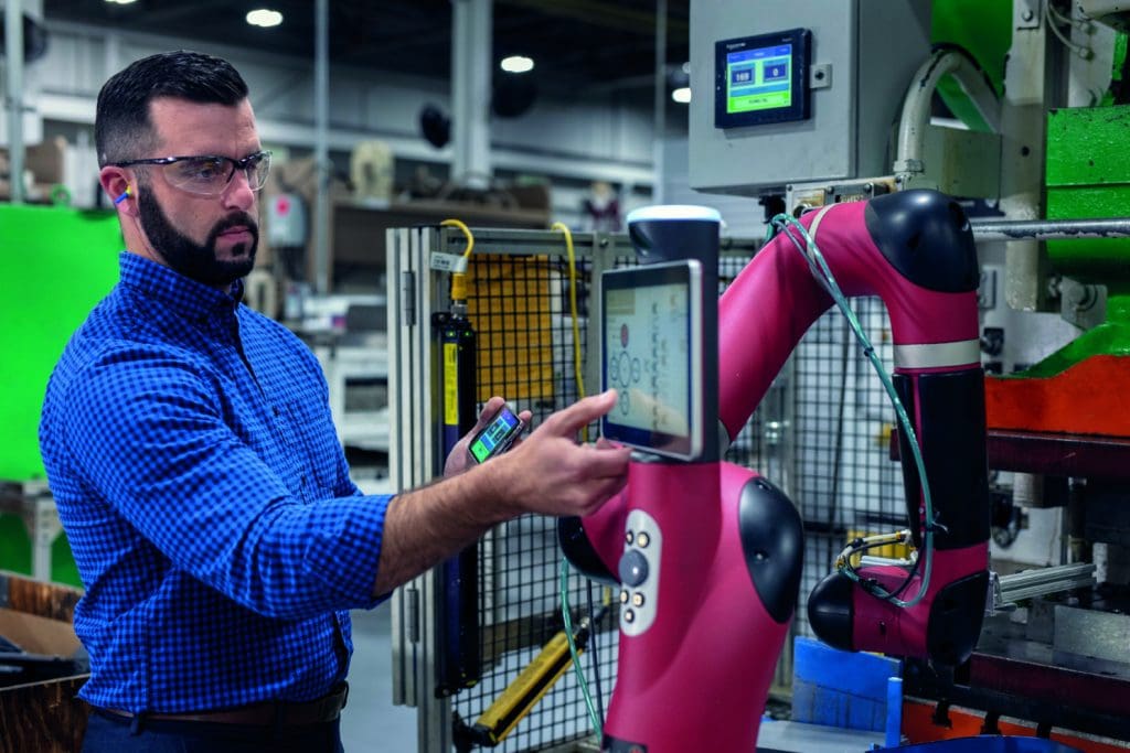 an engineer using smart operations at a factory where information is predominantly digital