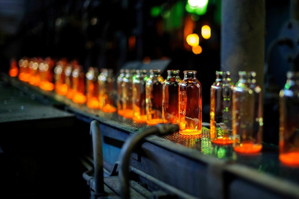 Glass bottles on a manufacturing line. 