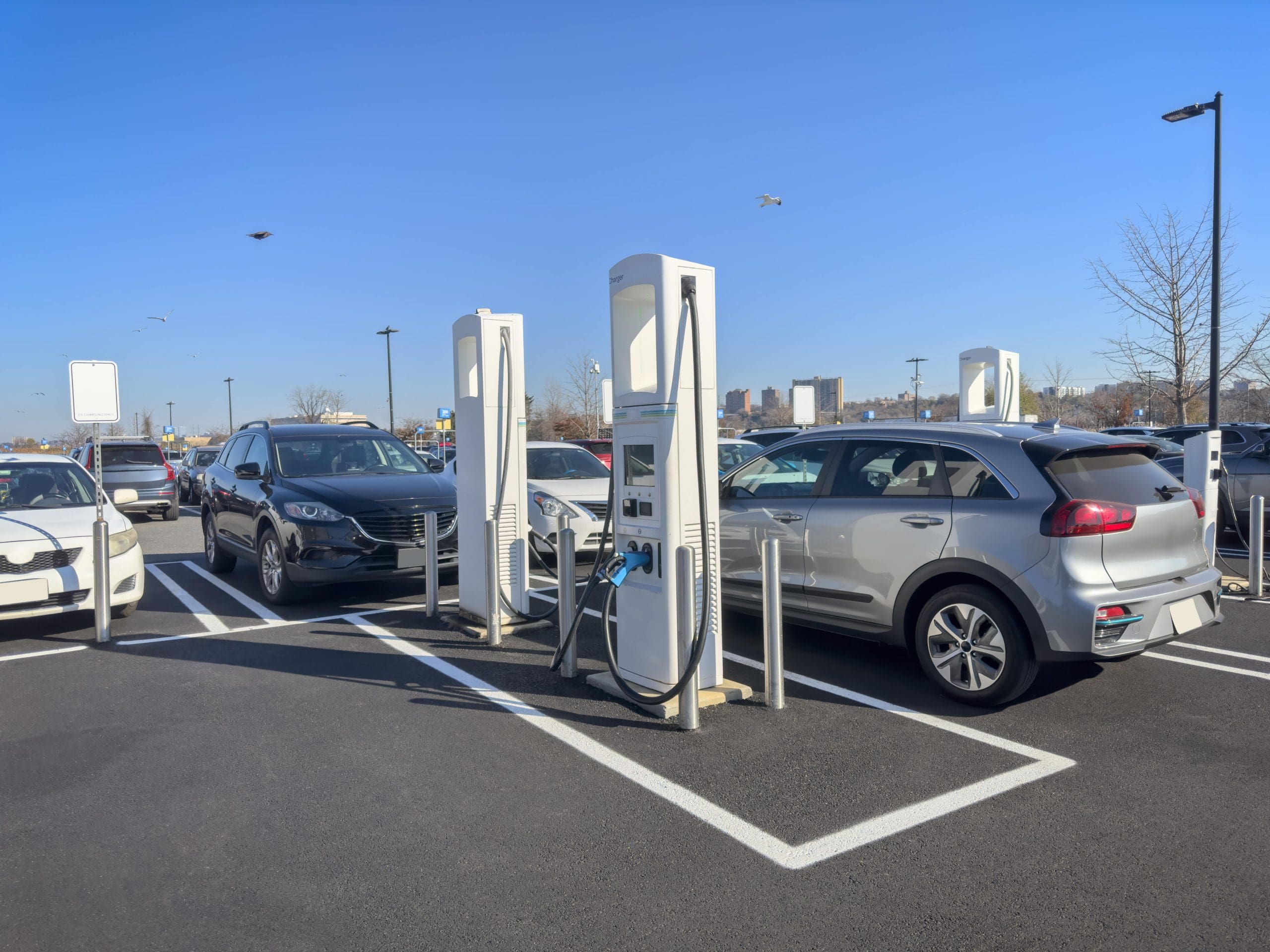 An electronic vehicle (EV) at a charging station.