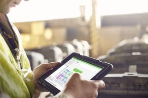 A person holding a tablet.