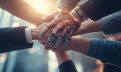 Humans connect with a group stacking hands with a humanoid robots hand symbolizing teamwork between an AI agent and humanity as a team using autonomy and agentic automation