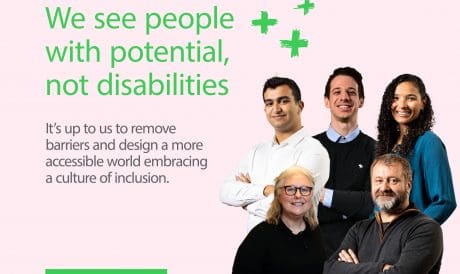 Image Description: A light pink background features the large green text: “We see people with potential, not disabilities.” Below it, smaller gray text reads: “It’s up to us to remove barriers and design a more accessible world embracing a culture of inclusion.” To the right, five Schneider Electric employees of different ages and backgrounds stand together, smiling and facing forward. Three green hand-drawn plus signs appear above them. At the bottom left, there is a green box with the Schneider Electric logo and the words “Life Is On.”
